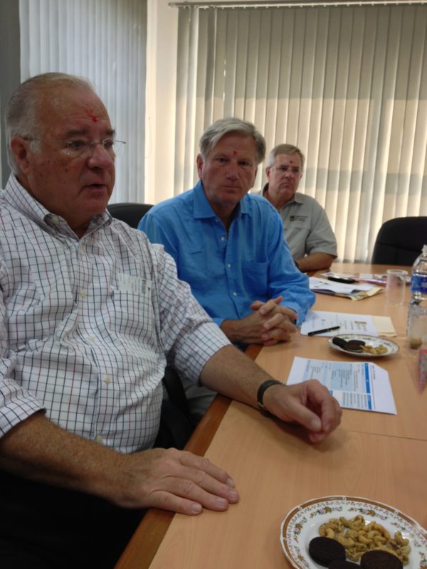 Image of Joe Ricketts at a conference table